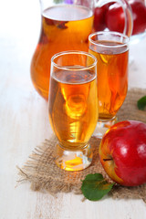 Apple juice and fresh red apples