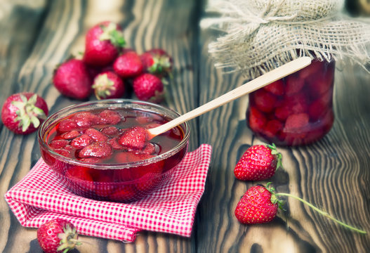 Strawberry Jam Marmalade In Glass Bowl On Wooden Background.