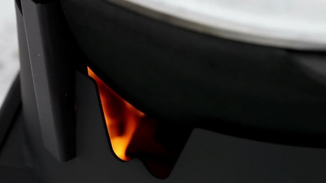 Close-up shot of the flame in the furnace of the wood stove
