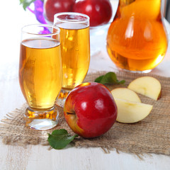 Apple juice and fresh red apples