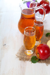 Apple juice and fresh red apples