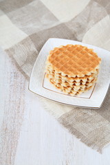 Tasty waffles on a white plate
