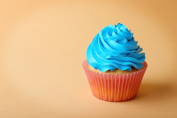 Birthday cupcake on color background