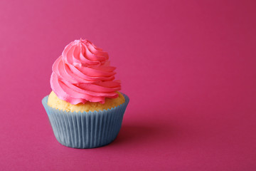 Birthday cupcake on pink background