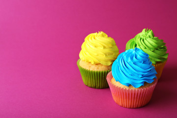 Birthday cupcakes on pink background