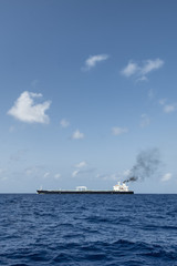 cargo ship sailing in still water