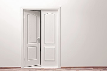 White wall and open door indoors