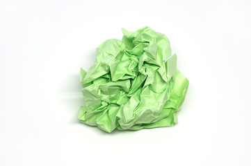 Crumpled green paper ball isolated on a white background