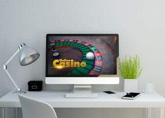 modern clean workspace withonline casino website on screen