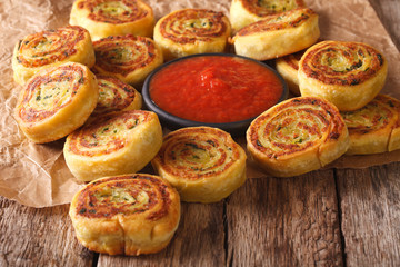 Obraz na płótnie Canvas Fried spicy potato rolls and tomato sauce closeup. horizontal 