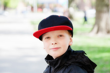 Portrait of a boy in a cap looking at the camera