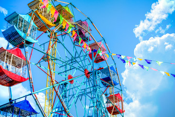 Ferris wheel on clouds background