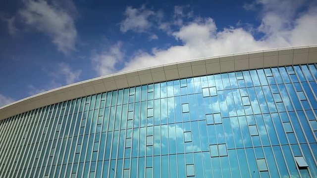 Office building reflecting the blue sky