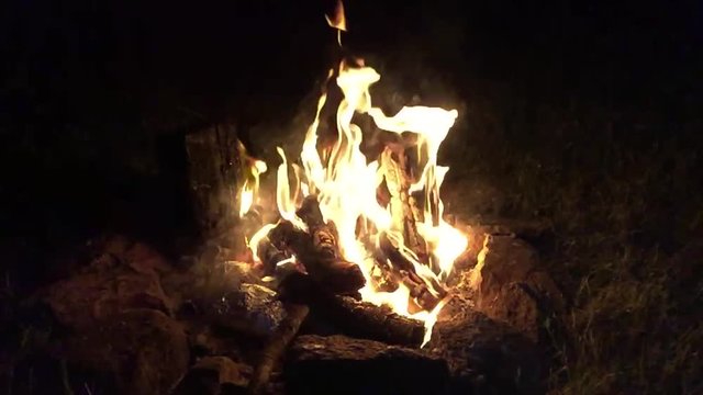 Burning fire in slow motion hiking outdoors