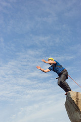 Jump off the cliff with a rope.