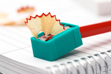 red pencils,sharpener and chips