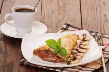 Crepes with chocolate cream and banana