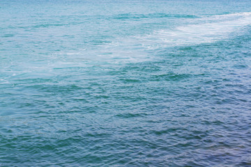 Blue sea surface with waves
