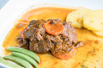 Beef stew with carrot. Top view.
