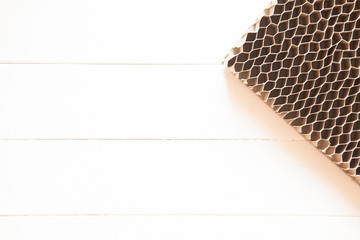 Honeycomb cardboard. Geometric background with copyspace. Recyclable kraft paper cardboard.