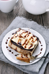 Banana cheesecake with chocolate syrup