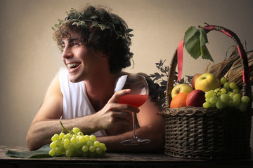 Laughing Bacchus holding a glass - obrazy, fototapety, plakaty