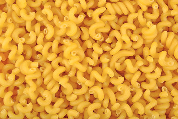 Uncooked italian pasta as background texture