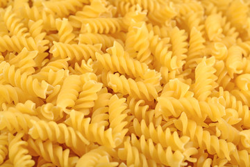Uncooked italian pasta fusilli close up