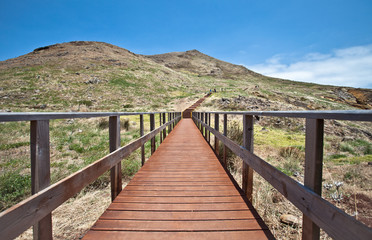 Fototapeta premium Wooden walkways on the way to Pico do Furado in Madeira island