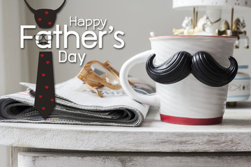 Cup with mustache on vintage cabinet for fathers day concept