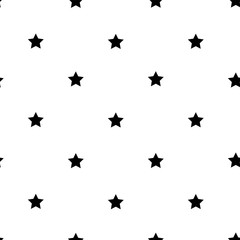 Little black stars on a white background seamless pattern