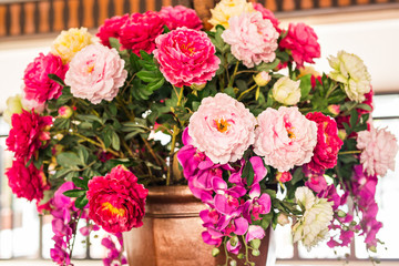 Delicate beautiful bouquet of roses, orchid and other flowers. Closeup.
