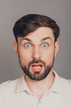 Portrait of shocked young guy with open mouth