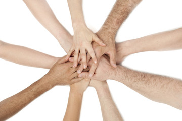 diverse group of people holding hands together