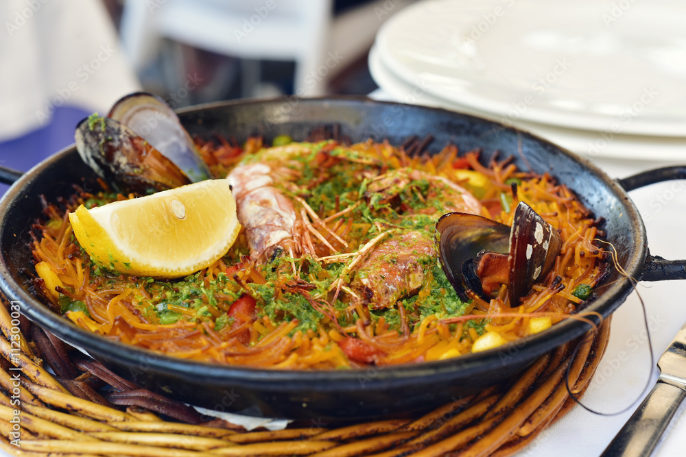 Poster spanish fideua, a typical noodles casserole