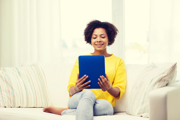 happy african american woman with tablet pc