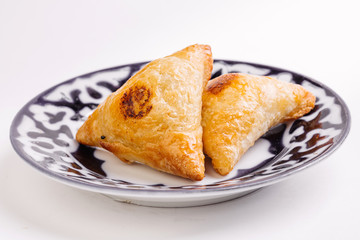 Delicious samosa pies with meat on plate. Menu, restaurant, reci