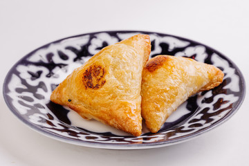 Delicious samosa pies with meat on plate. Menu, restaurant, reci
