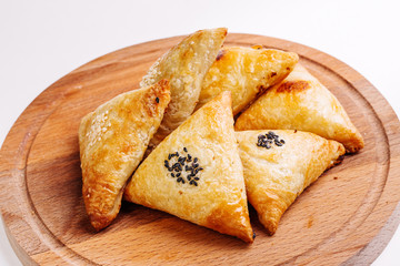 Delicious samosa pies with meat on plate. Menu, restaurant, reci