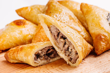 Delicious samosa pies with meat on plate. Menu, restaurant, reci