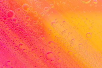 Beautiful soft oil mixed with water on colorful gradient background