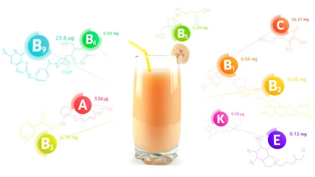 Vitamins fly out of the glass of banana cocktail