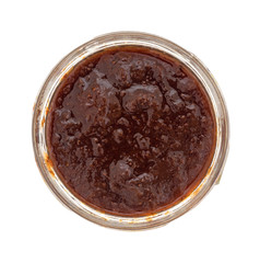 Jar of wild strawberry preserves on a white background