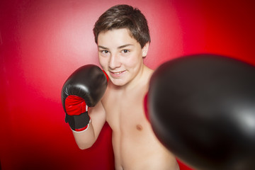 Fototapeta Close-up photo of a boxer with red gloves obraz
