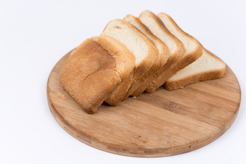 Toast bread isolated over white on the cutting board