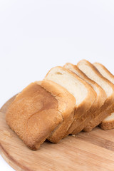 Toast bread isolated over white on the cutting board