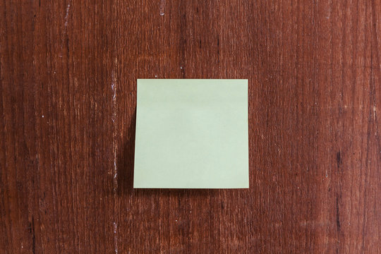 Pen and Notepad on the wooden desk.