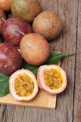 Ripe passion fruit is delicious on wood background.