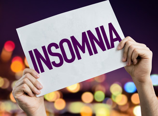 Insomnia placard with night lights on background