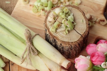 fresh lemon grass is herb on wood background.
